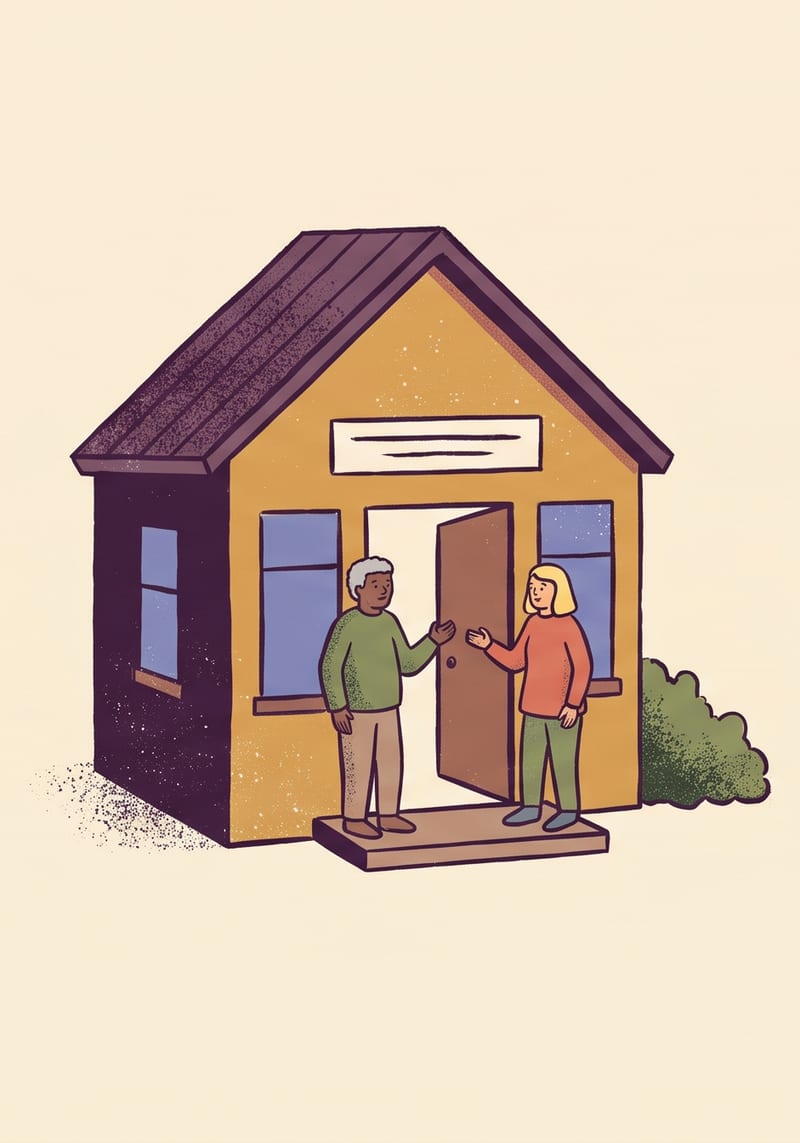A community centre with its door open, two people talking on the step.